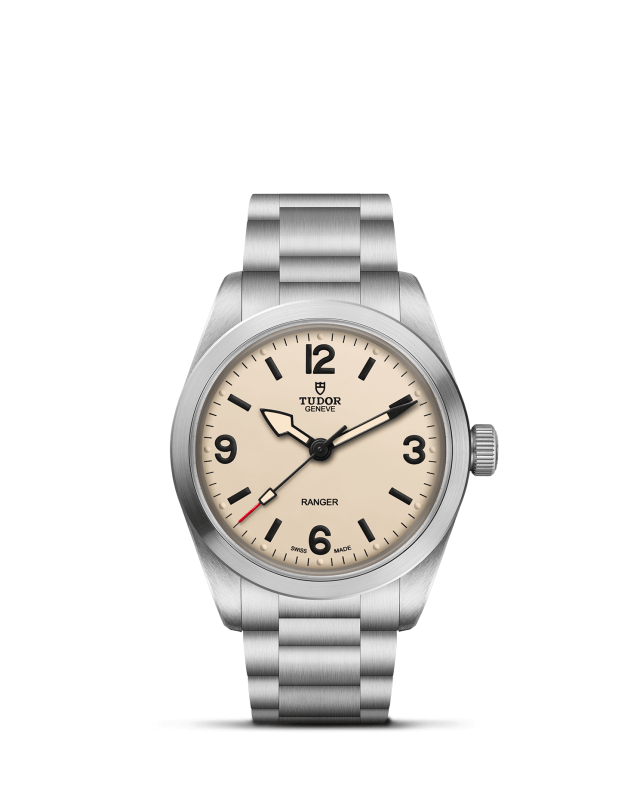 Silver Tudor watch with beige dial on a white background

Tudor Ranger M79930-0007 Bandiera Jewellers