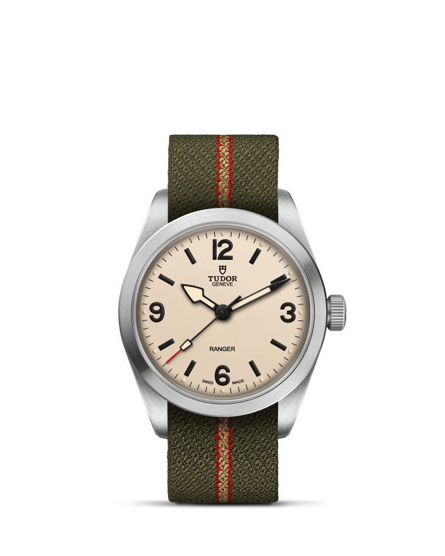 Watch with a green strap and beige dial on a white background

Tudor Ranger M79930-0008 Bandiera Jewellers