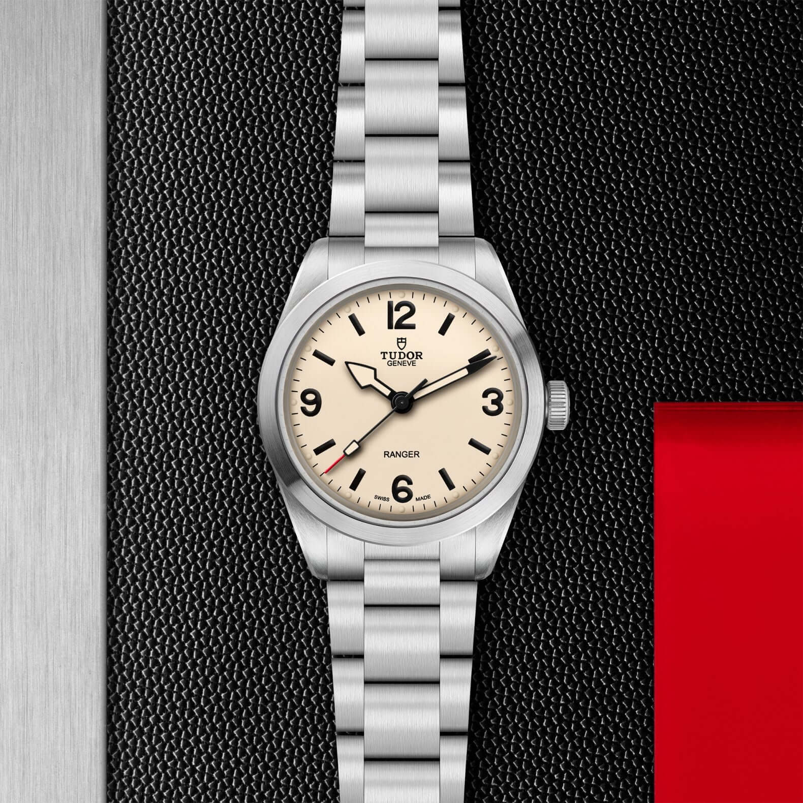 Silver Tudor watch with beige dial on a white background

Tudor Ranger M79950-0008 Bandiera Jewellers