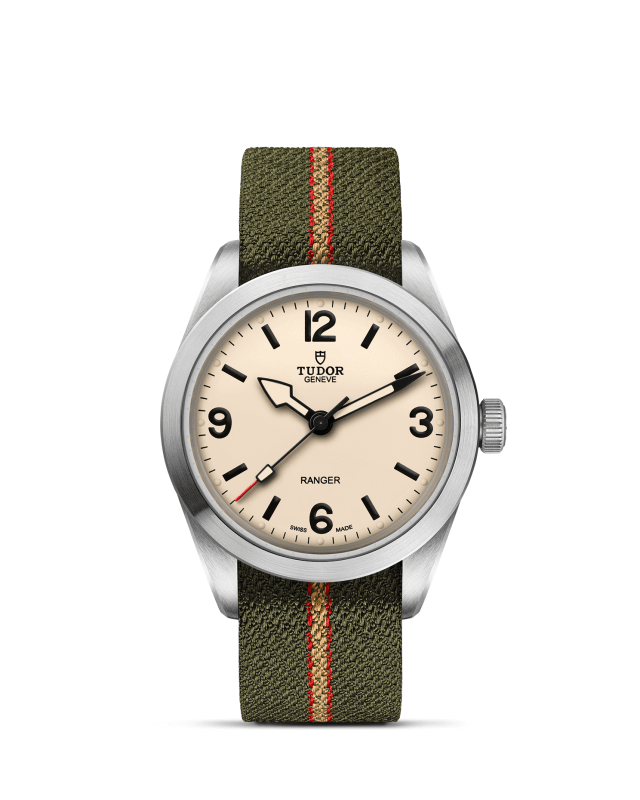 Tudor watch with green strap and beige dial on a white background

Tudor Ranger M79950-0011 Bandiera Jewellers