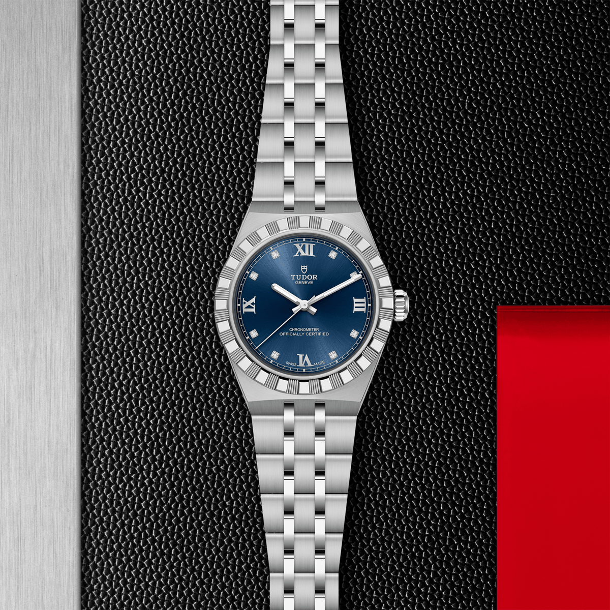 Silver watch with a blue dial on a textured black and red background

Tudor Royal 30mm M2830A1A0-0001 Bandiera Jewellers