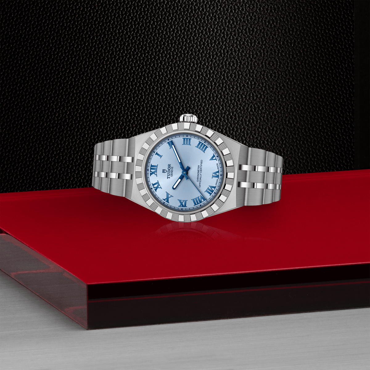 Silver watch with blue face on a red platform against a black background

Tudor Royal 30mm M2830A1A0-0004 Bandiera Jewellers