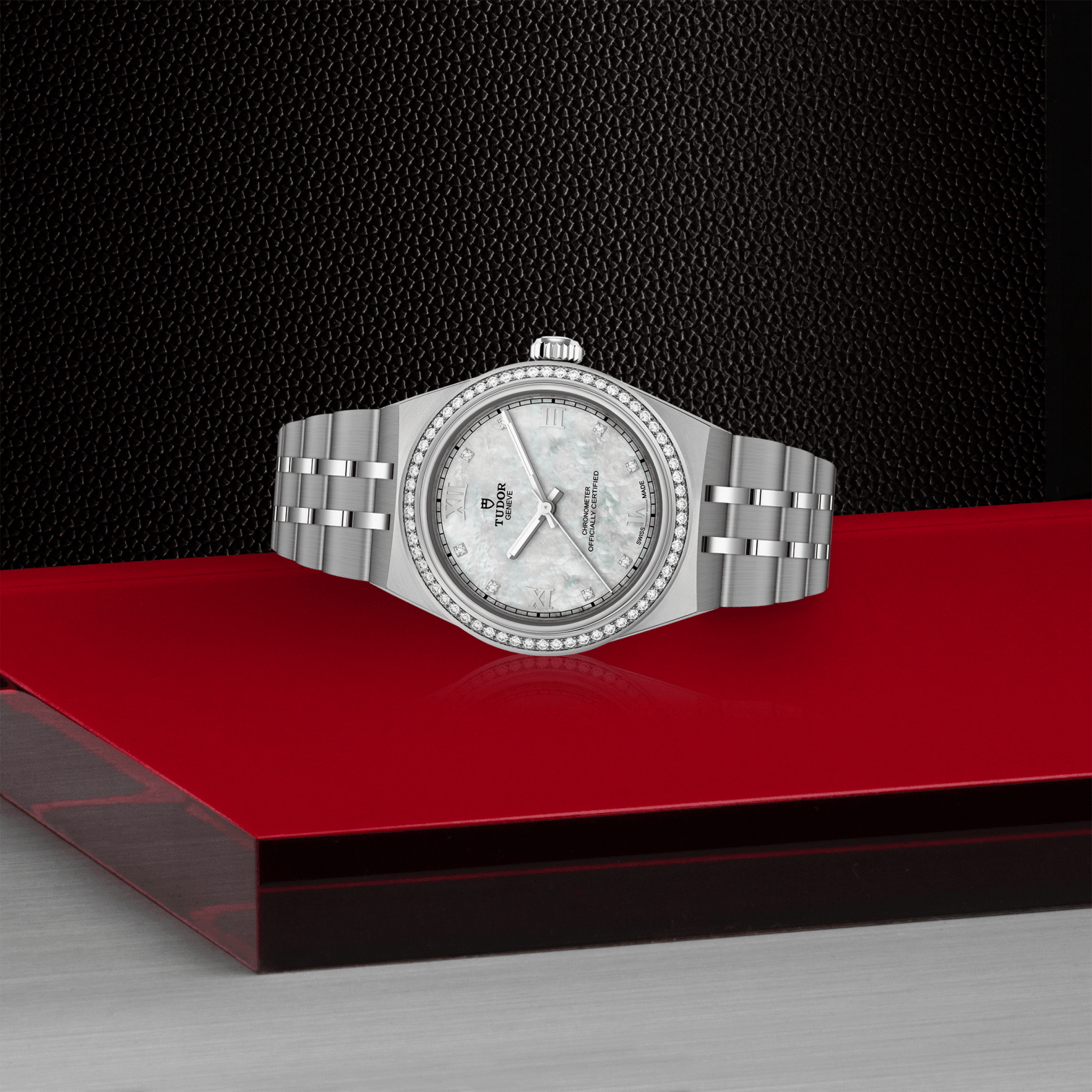 Silver watch with a detailed face on a red platform against a black background

Tudor Royal 30mm M2830A1S0-0001 Bandiera Jewellers