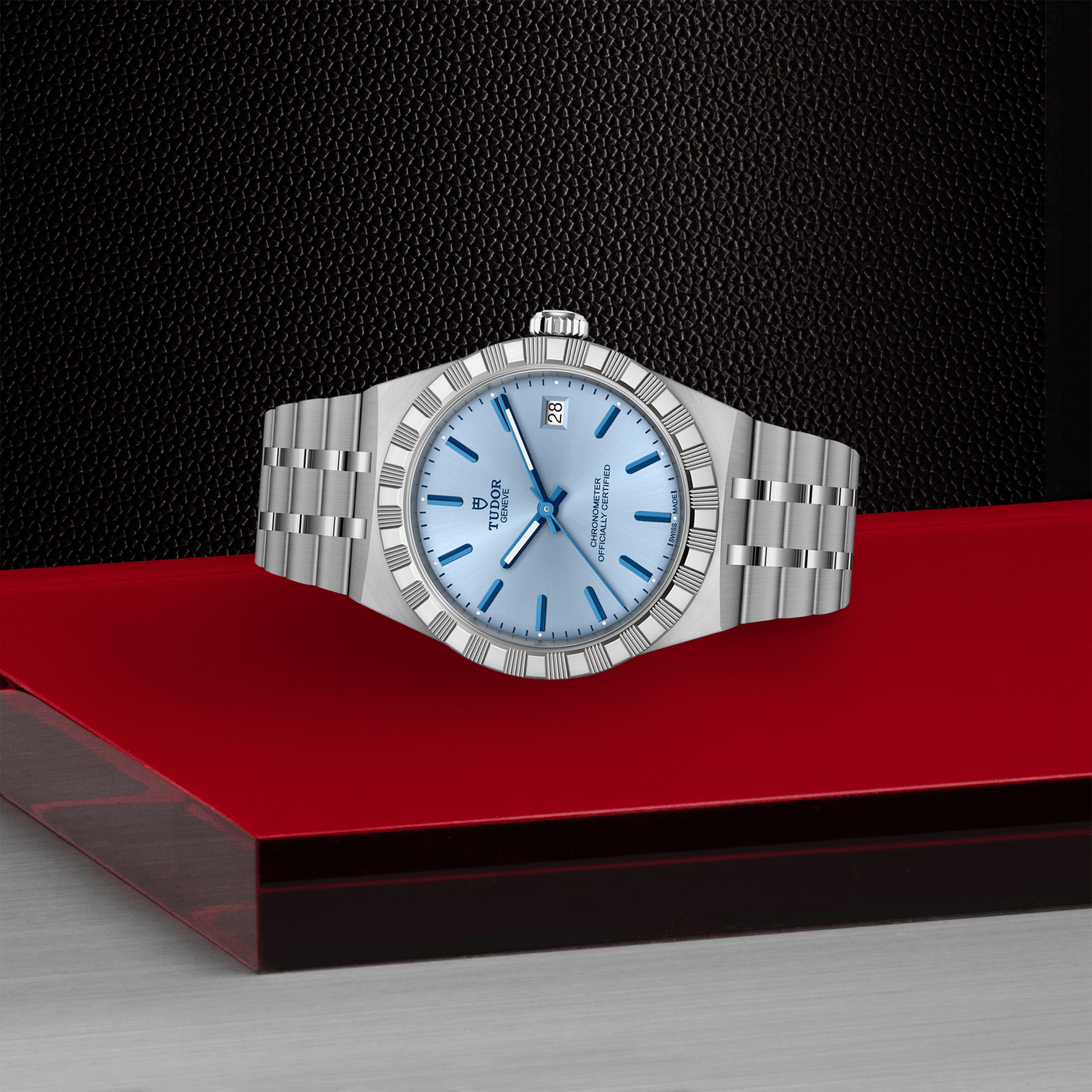Silver watch with blue face on a red platform against a black background

TUDOR Royal 36mm M2836C1A0-0106 Bandiera Jewellers