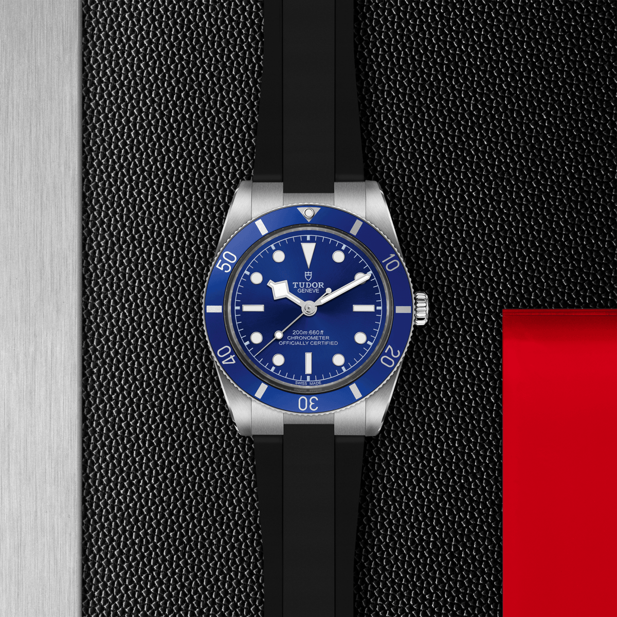 Watch with blue dial and black strap on a textured surface

Tudor Black Bay 54 M79000B-0002 Bandiera Jewellers