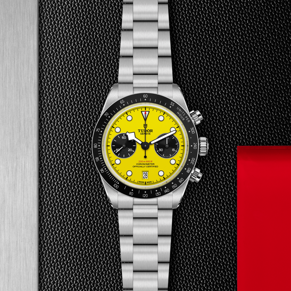Watch with yellow face and silver bracelet on a textured black background

TUDOR Black Bay Chrono 39 M79310N-0001 Bandiera Jewellers